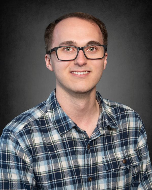 Headshot of Bradford (Ford) Johnson, a data analyst smiling in professional attire.